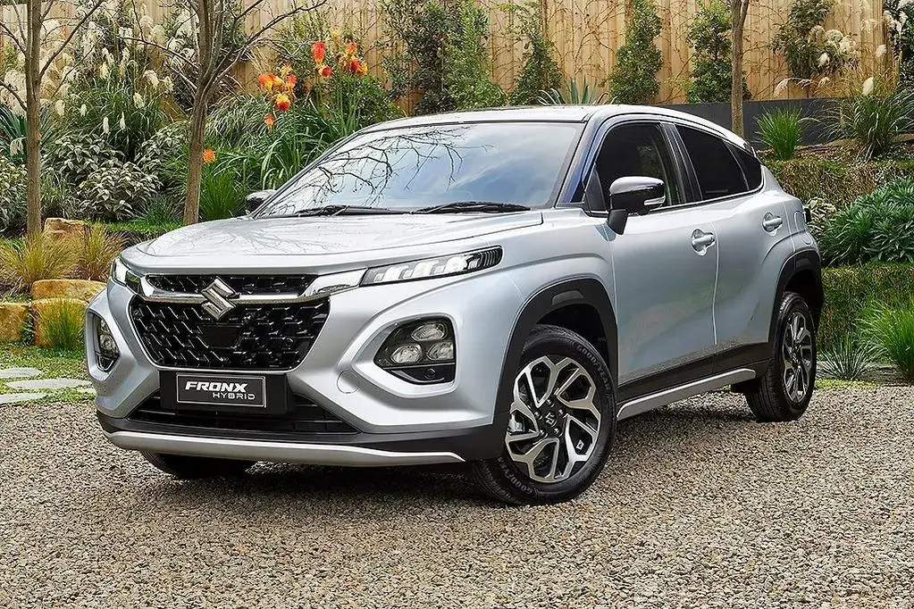 Silver Suzuki Fronx Hybrid 2024 front view parked outside